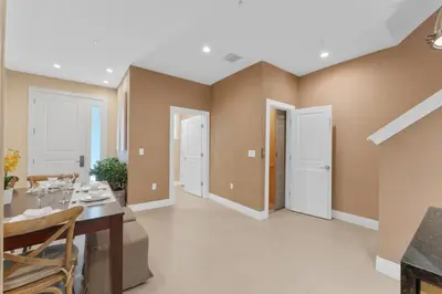 a dining room with a table and chairs at Luxury 4BR Townhouse Next to Disney Orlando 3175 in Orlando