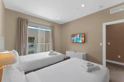 a bedroom with two beds and a window at Luxury 4BR Townhouse Next to Disney Orlando 3173 in Orlando