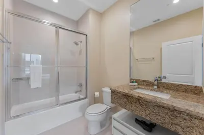a bathroom with a toilet and a shower and a sink at Luxury 4BR Townhouse Next to Disney Orlando 3173 in Orlando