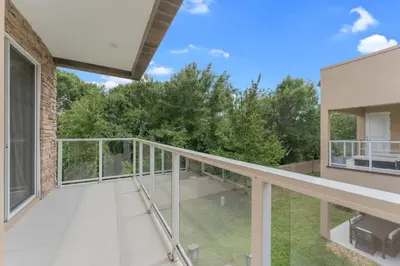 an empty balcony of a house with trees at Luxury 4BR Townhouse Next to Disney Orlando 3173 in Orlando