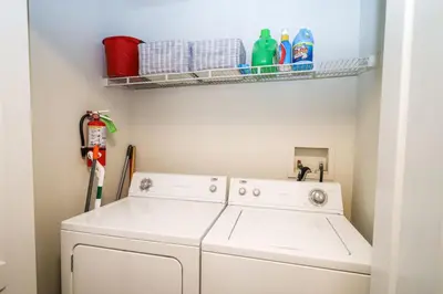 a laundry room with a washer and dryer at Runaway Beach Club Resort Condo Apt Disney 15103 in Kissimmee