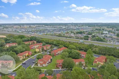 an aerial view of a suburb with houses and a highway at 8496 Resort 3BR Condo by Disney World Orlando in Kissimmee