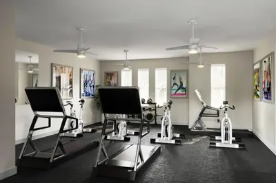a gym with three exercise bikes in a room at Modern Townhouse Heated Pool Disney Orlando 1502R in Orlando