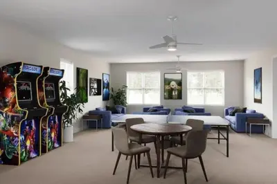 a room with a table and chairs and a couch at Modern Townhouse Heated Pool Disney Orlando 1502R in Orlando