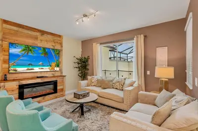 a living room with a couch and a fireplace at Storey Lake Resort Townhouse near Disney Orlando 4847 in Kissimmee