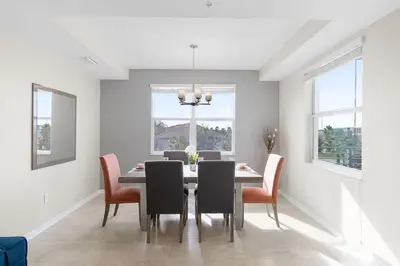 a dining room with a table and chairs at Modern Storey Lake Resort Disney Orlando 4751-306 in Kissimmee