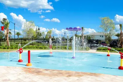 a pool with a water fountain in a park at Modern Storey Lake Resort Disney Orlando 4751-306 in Kissimmee