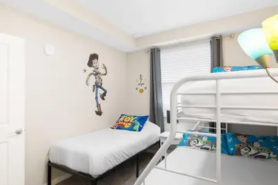 a room with a bunk bed and a bunk bedvelt at Modern Storey Lake Resort Disney Orlando 4751-306 in Kissimmee