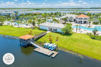 an aerial view of a resort with a dock at Modern Storey Lake Resort Disney Orlando 3171-302 in Kissimmee