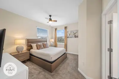 a bedroom with a bed and a window at Modern Storey Lake Resort Disney Orlando 3171-301 in Kissimmee