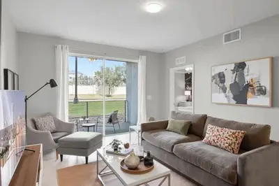 a living room with a couch and a table at Modern Storey Lake Resort Disney Orlando 4741-104 in Kissimmee