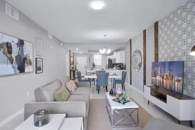 a living room with a couch and a table at Modern Storey Lake Resort Disney Orlando 4741-104 in Kissimmee