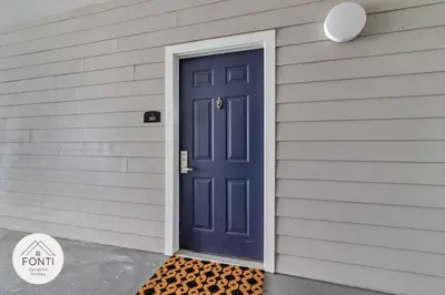 a blue door on the side of a house at Secret Lake Resort 2BR Condo Apt Disney 3176-301 in Kissimmee