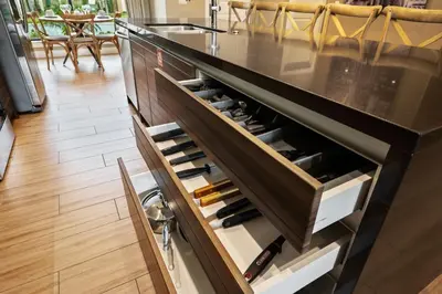 a kitchen with a counter with wine bottles at MAGIC VILLAGE - Near Disney - 4BDR in Orlando