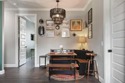 a dining room with a table and a couch at 5 Bdr 4,5 Bth Villa - Pool Table - Fenced Yard in Orlando