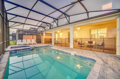 an indoor swimming pool with a glass roof at Perfect 9 Bed 5 Bath Home/Games room/ Private pool in Kissimmee