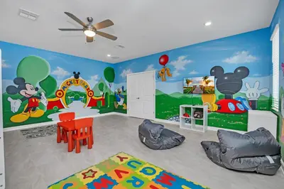 a childs room with a mickey mouse mural at AVH-2746-SL in Kissimmee