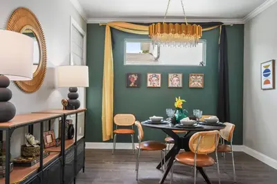 a dining room with a table and chairs at Pool Table, BBQ, Walking Distance to Local Gems in Orlando