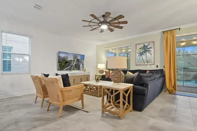 a living room with a couch and a table at Welcome to the Ultimate Vacation Wonderland in Kissimmee