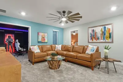a living room with a couch and a ceiling fan at Welcome to the Ultimate Vacation Wonderland in Kissimmee
