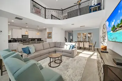 a living room with a couch and a table at Amazing Brand New 5BD, Resort Home/Games Room/Pool in Kissimmee