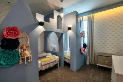 a childs room with a blue and white room with a bed at 5BR Family Haven Near Disney with Private Pool in Kissimmee