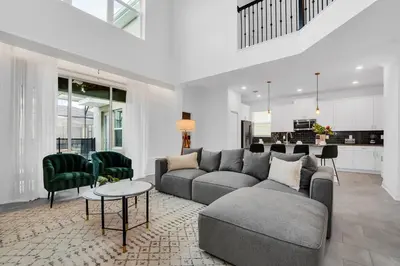 a living room with a couch and a table at 5BR Family Haven Near Disney with Private Pool in Kissimmee