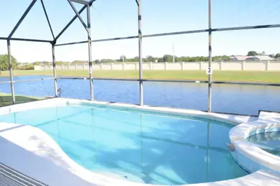 a large swimming pool in a tent with water at 6 bed property - Indian Creek in Kissimmee