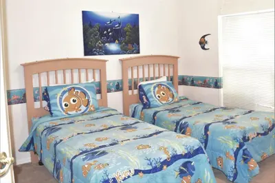 two beds in a childs room with two bedsskirtspectspectspects at 6 bed property - Indian Creek in Kissimmee