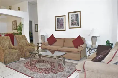 a living room with a couch and a table at 6 bed property - Indian Creek in Kissimmee