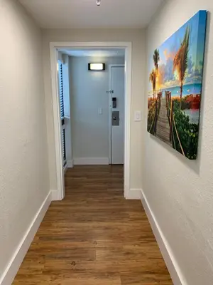 a hallway with a painting hanging on a wall at 12 - Universal Studios, International Dr in Orlando