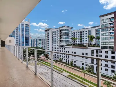 an apartment balcony with a view of buildings at Lake Eola Thornton Park Modern 2Bed 2Bath Secure Parking in Orlando