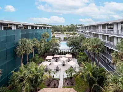 an aerial view of a resort with a pool and palm trees at Charming 1BR Home in Orlando minutes to Disney in Kissimmee