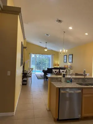 a kitchen and living room with a couch at 2029 Morning in Orlando
