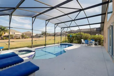 a swimming pool with a canopy and a patio at Beautiful Emerald Island Resort Retreat with Private Pool and Spa Close to Disney in Kissimmee