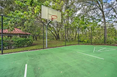 a basketball hoop on a tennis court at 5 Mi to Disney Ideal Family Getaway with Theater! in Kissimmee