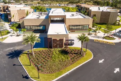an aerial view of a house with palm trees at Magic Village Yards Trademark Collection by Wyndham in Orlando