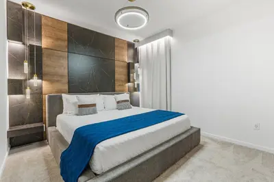 a bedroom with a large bed with a blue blanket at Brand NEW 10Bedrooms At Paradiso Grande in Orlando