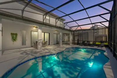 a swimming pool with a glass roof on a house at Brand NEW 10Bedrooms At Paradiso Grande in Orlando