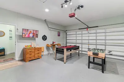 a room with a ping pong table and other items at Single-Level Home w Heated Pool & 9MI to Disney in Orlando