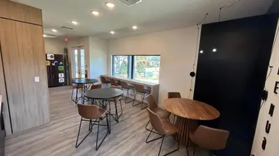 a restaurant with tables and chairs in a room at Tranquil Trail Bungalow in Kissimmee