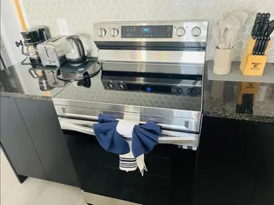a kitchen with a stainless steel oven in a kitchen at Tranquil Trail Bungalow in Kissimmee
