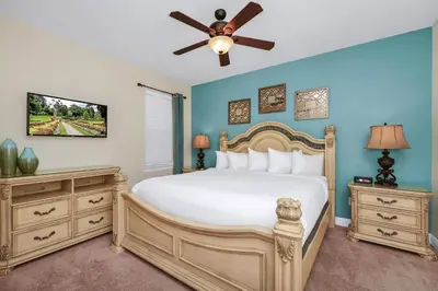 a bedroom with a bed and a ceiling fan at Charming Home Near Disney With Private Pool, Game Room And Waterpark & Resort Access At Encore Resorts Reunion - 410No in Kissimmee