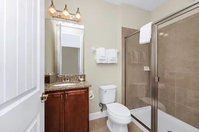 a bathroom with a toilet and a sink and a shower at Charming Home Near Disney With Private Pool, Game Room And Waterpark & Resort Access At Encore Resorts Reunion - 410No in Kissimmee