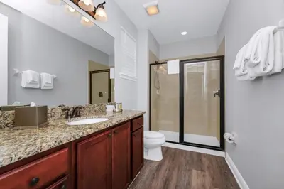 a bathroom with a sink and a toilet and a shower at Grand Home Near Disney With Private Pool And Waterpark & Resort Access At Encore Resorts Reunion - 7519Mr in Kissimmee