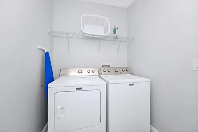 a kitchen with a white stove and a refrigerator at Grand Home Near Disney With Private Pool And Waterpark & Resort Access At Encore Resorts Reunion - 7519Mr in Kissimmee