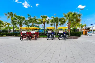 a group of four bikes parked in a parking lot at Grand Home Near Disney With Private Pool And Waterpark & Resort Access At Encore Resorts Reunion - 7519Mr in Kissimmee