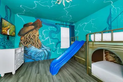 a childs room with a mural of a pirate ship at Glorious Home Near Disney With Game Room, Themed Rooms, Waterpark & Resort Access At Encore Resorts Reunion - 7643Wi in Kissimmee