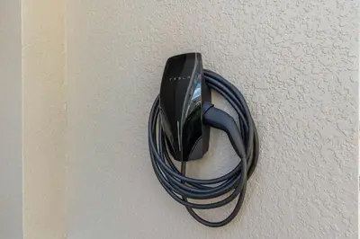 a black cord hanging on a wall at Tropical 7BR Heated Pool Pet Friendly Disney in Kissimmee