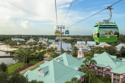 a gondola ride over a town with houses at Disney's Caribbean Beach Resort in Orlando